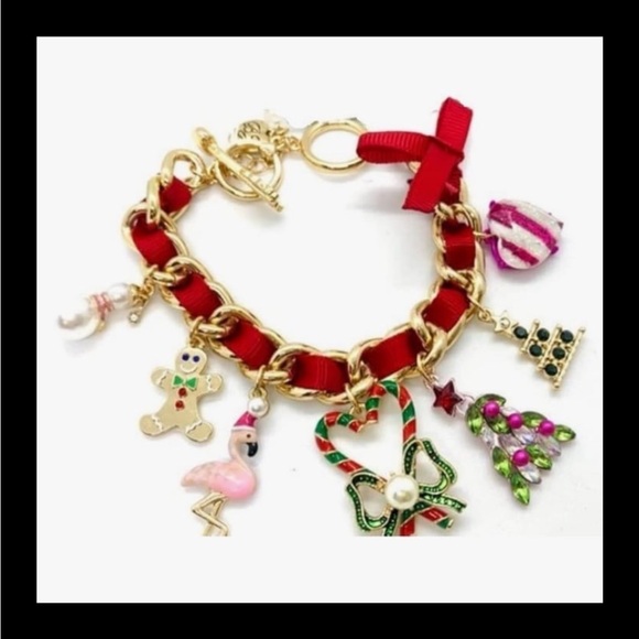 Betsey Johnson Jewelry - NWT gold with red ribbon Christmas charm bracelet